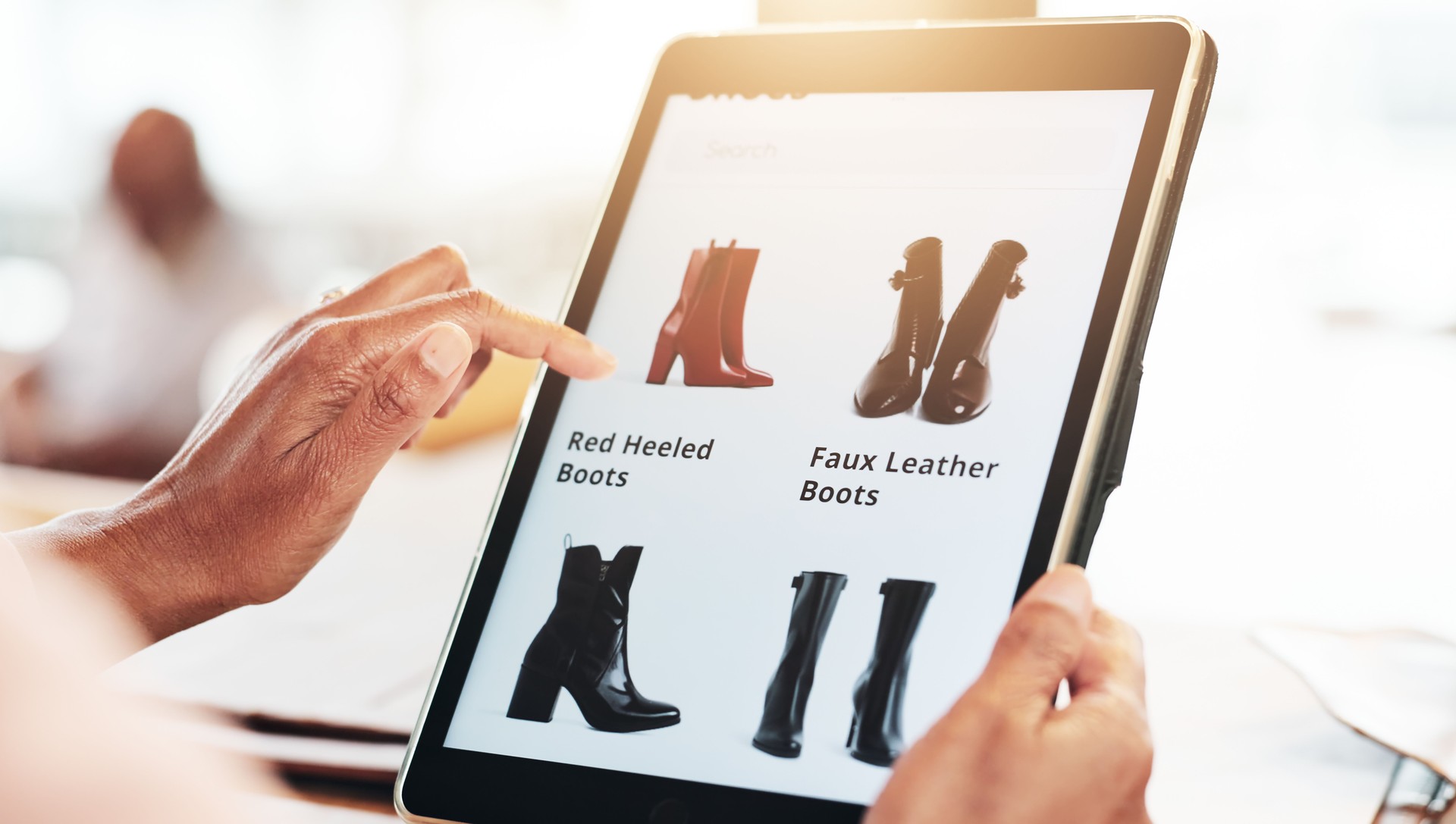 Hands, tablet and online shopping for shoes in home, click and search for discount, promotion and fashion. Person, touchscreen and ui with e commerce, boots and virtual boutique with app in house